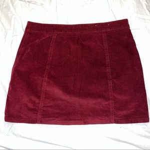 New Altard State wine colored corduroy mini skirt with brass buttons.